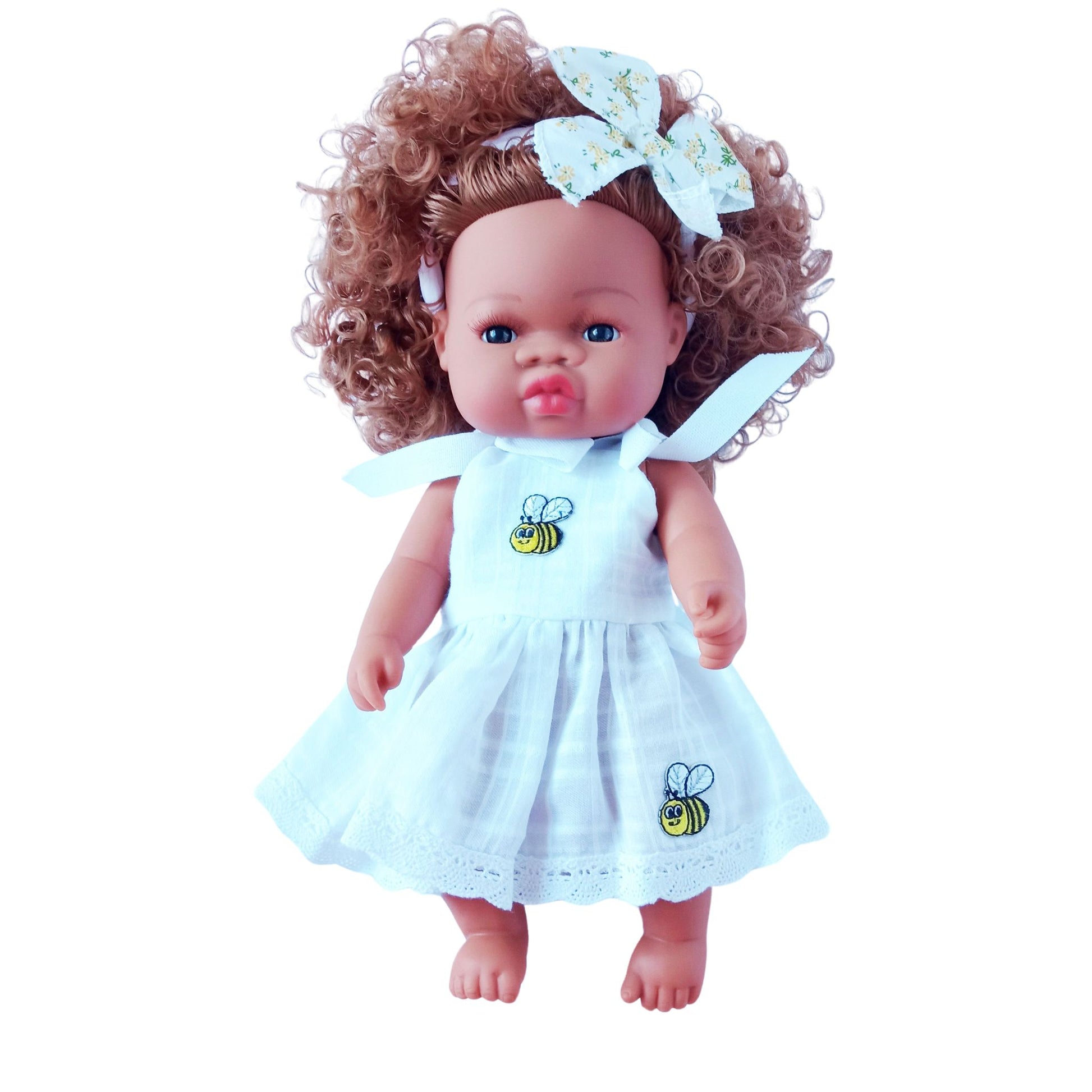 Doll in a white cotton sundress with embroidered bees, lace trim, and tied shoulder straps, accessorized with a matching bow headband, fits 34 cm dolls like Paola Reina or Baby Born