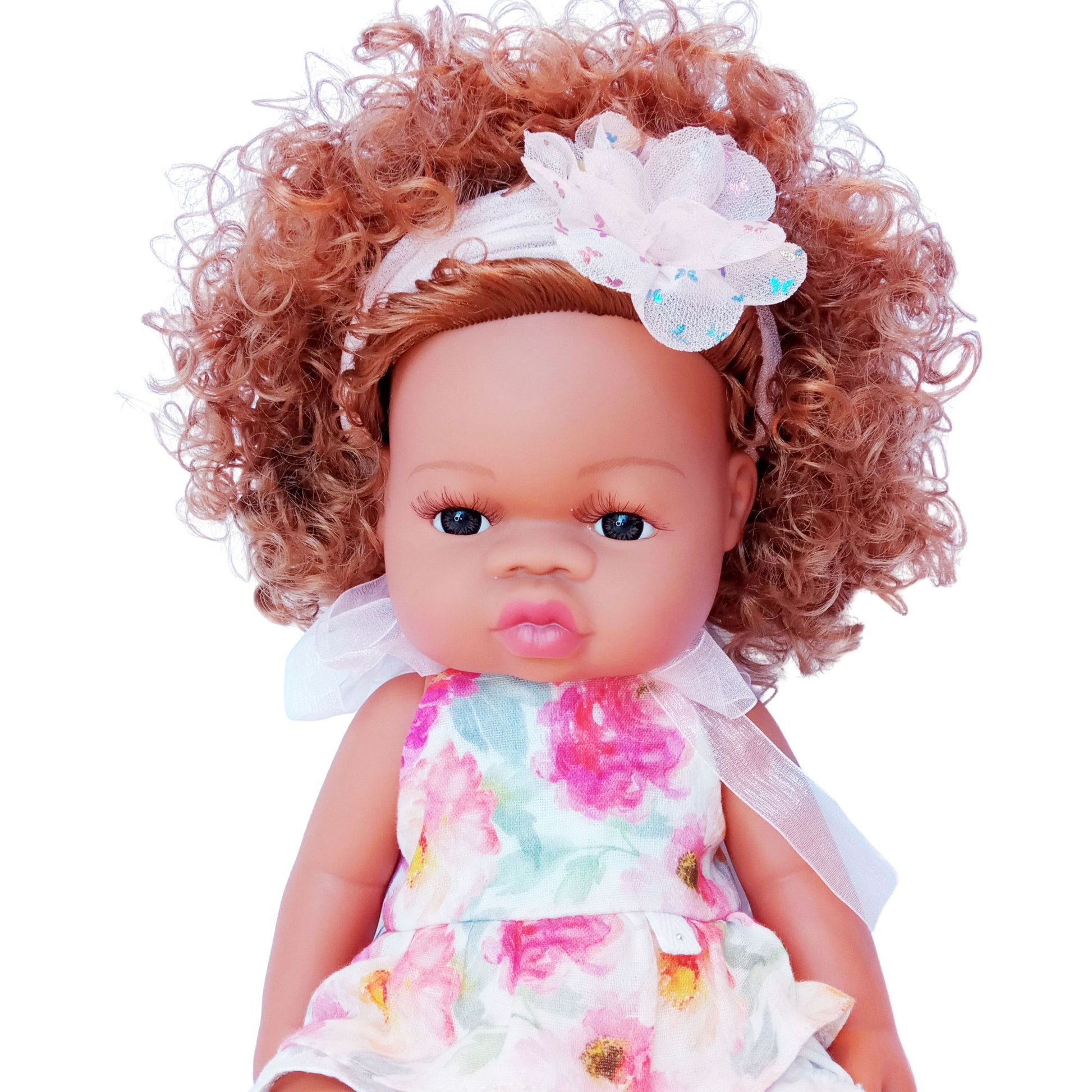 Doll wearing floral cotton top and white bloomers, styled for 34 cm dolls like Paola Reina and Baby Born.