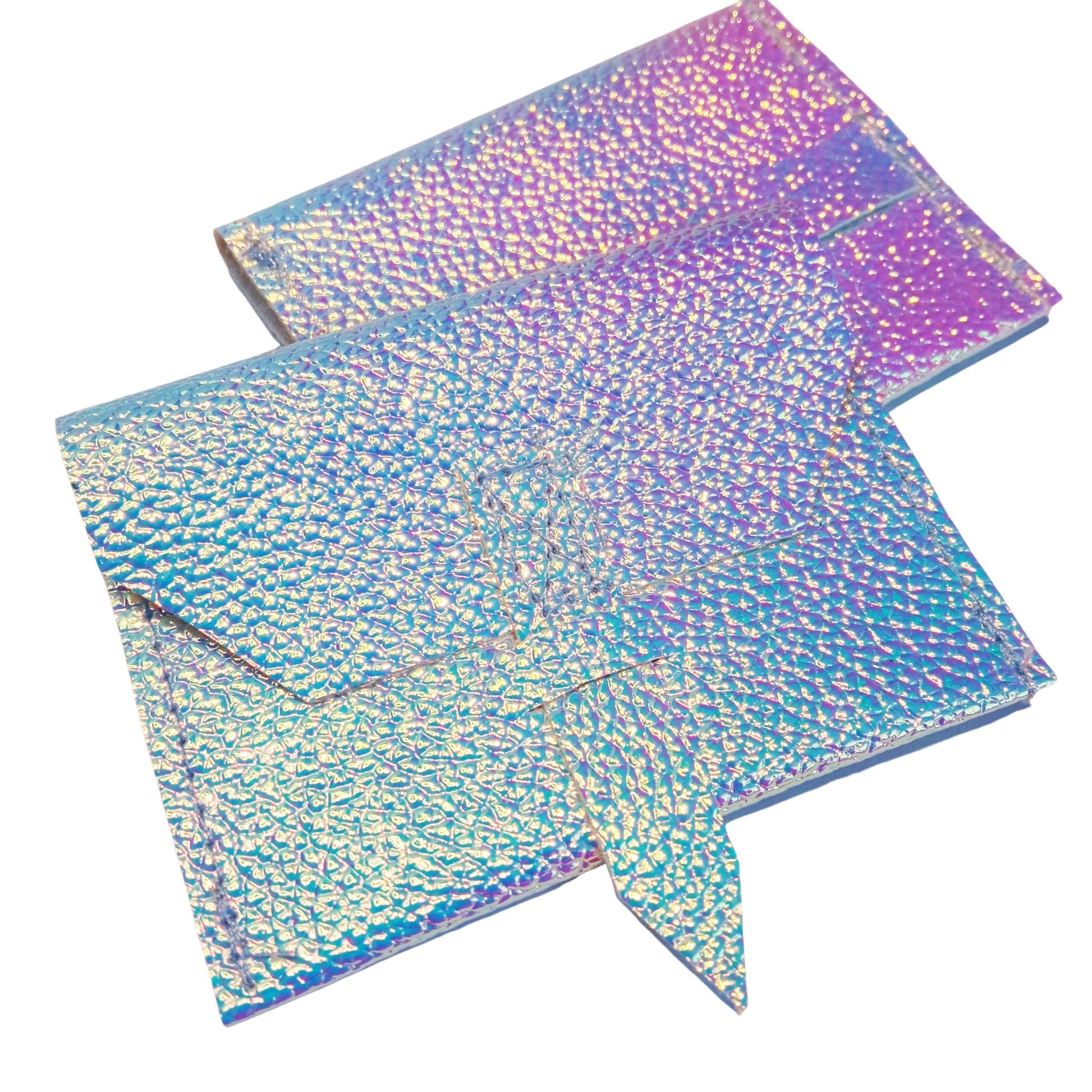 A shimmering holographic "Chameleon" clutch purse for Paola Reina 32 cm (12-inch) dolls, reflecting iridescent blue, pink, and purple hues.