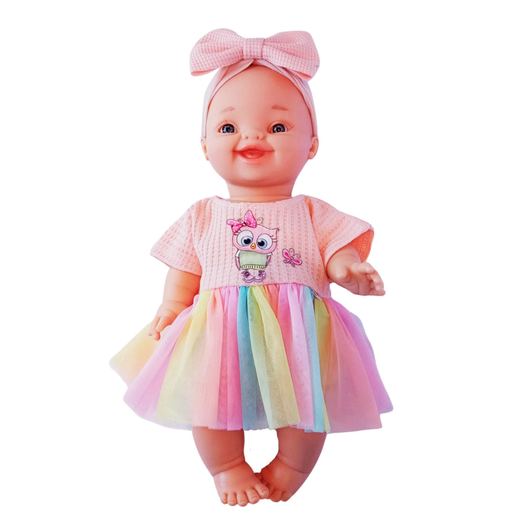 Smiling doll in peach jersey dress with rainbow tulle skirt and cute owl embroidery, perfect for 34 cm Paola Reina or Baby Born dolls.