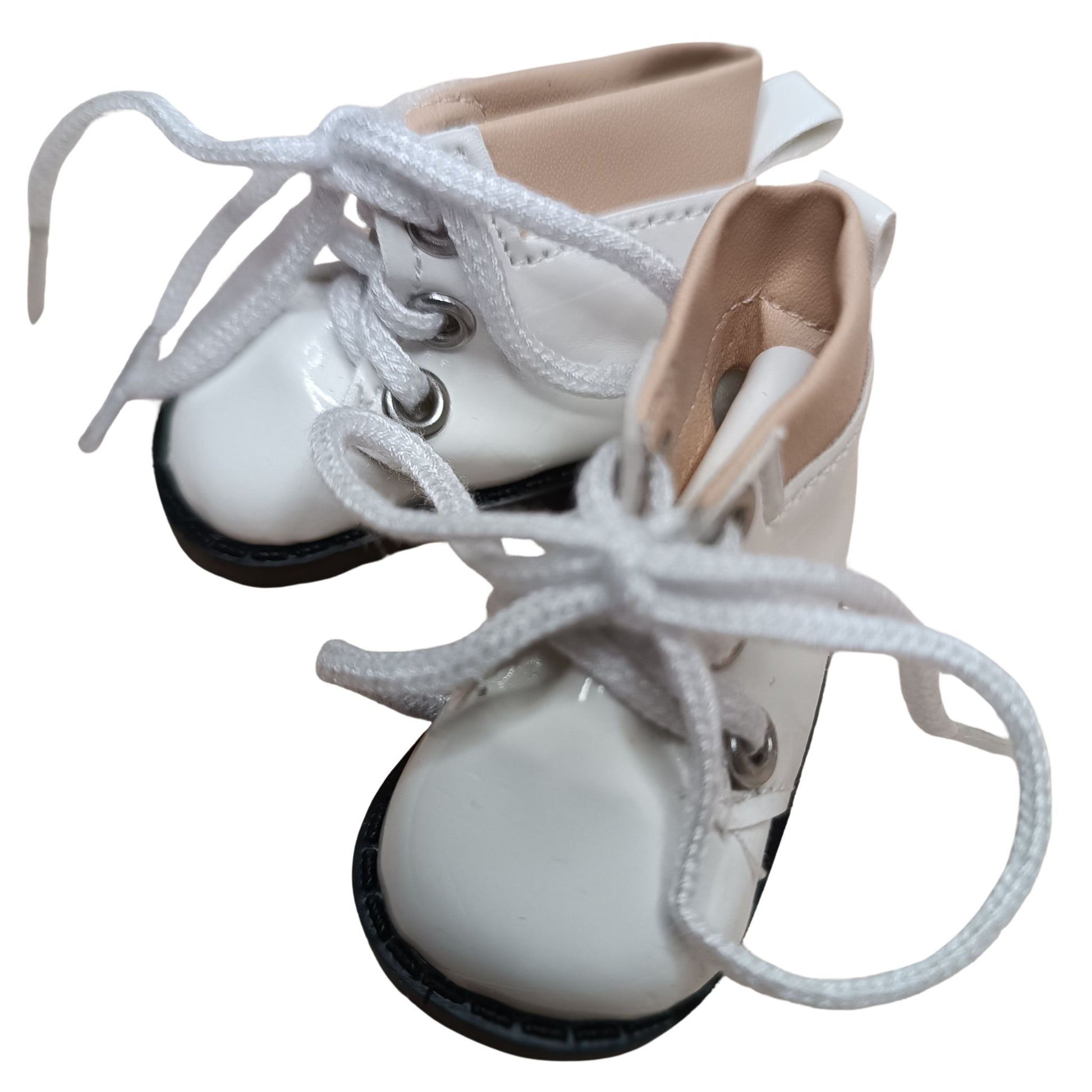 Glossy white lace-up boots with beige cuffs, designed for 32 cm Paola Reina dolls. Featuring white laces, metal eyelets, and black soles for a stylish look.