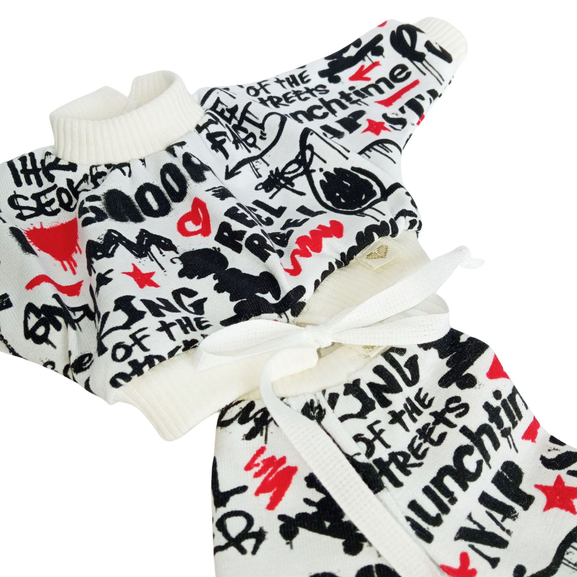 For Paola Reina 32 cm doll a black, red, and white graffiti-print tracksuit styled in a modern streetwear look.