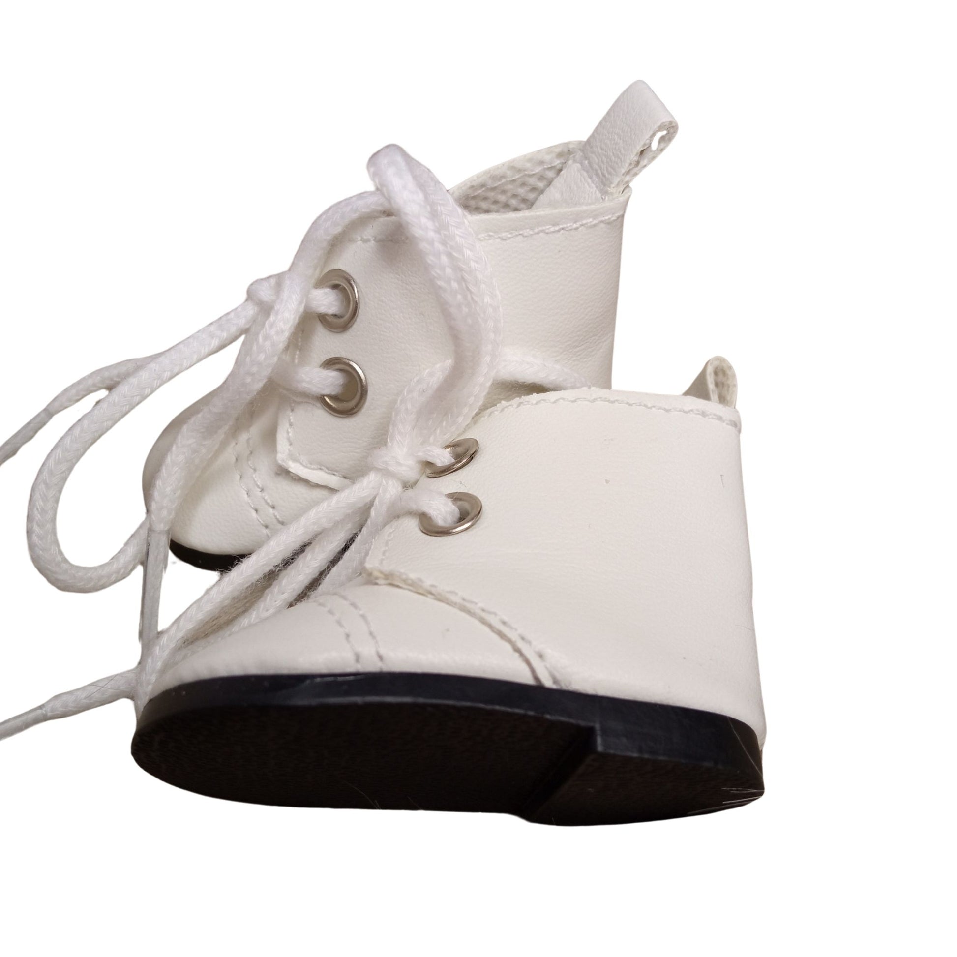 A pair of white lace-up boots for dolls, featuring silver eyelets and black soles, perfect for adding stylish charm to any doll outfit.
