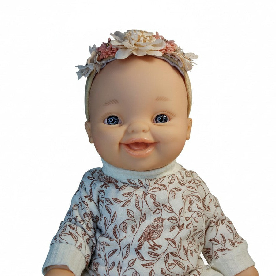 Baby Born doll wearing handmade elastic floral headband