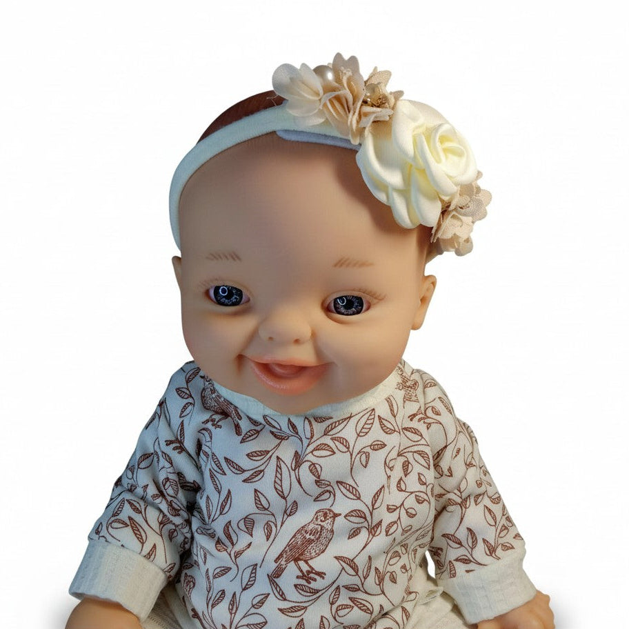 Baby Born doll wearing handmade elastic floral headband